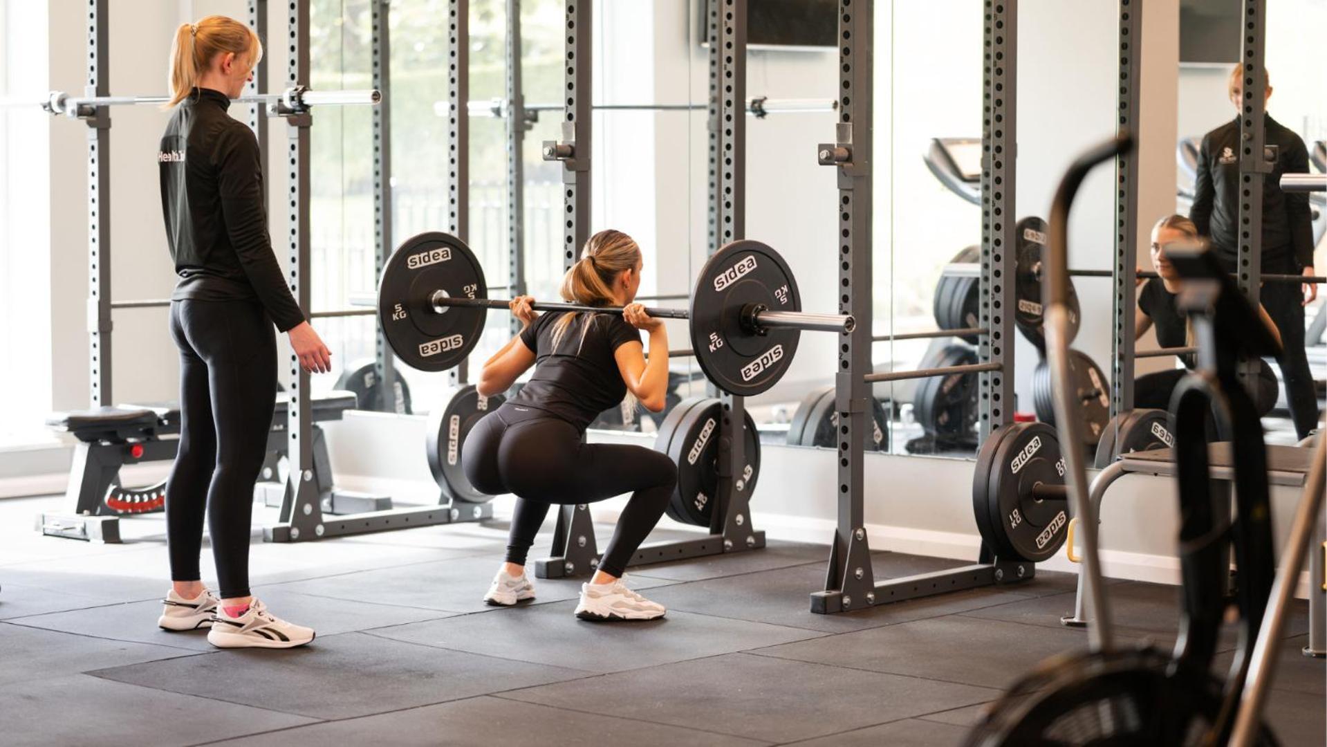 The Culloden Estate And Spa Holywood  Εξωτερικό φωτογραφία A woman performing a back squat with a barbell